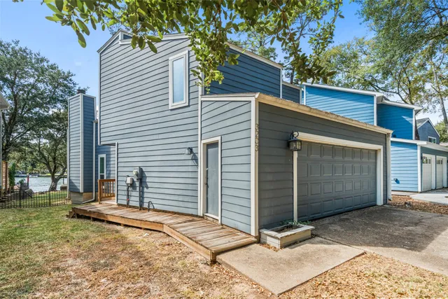 a front view of a residential apartment building with a yard