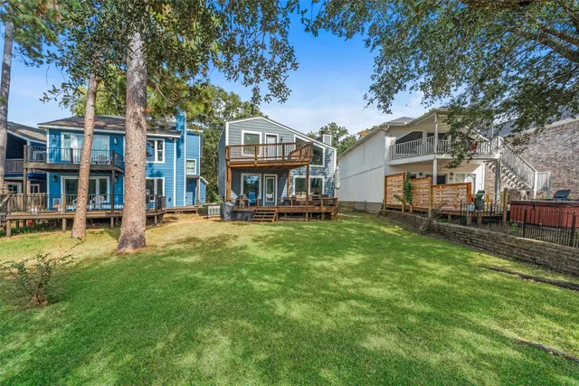a front view of a residential apartment building with a yard