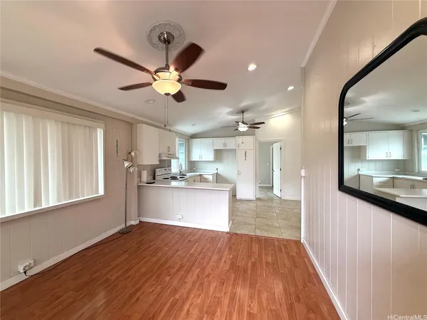 a view of a kitchen with a sink and a window