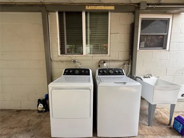 a utility room with dryer and washer