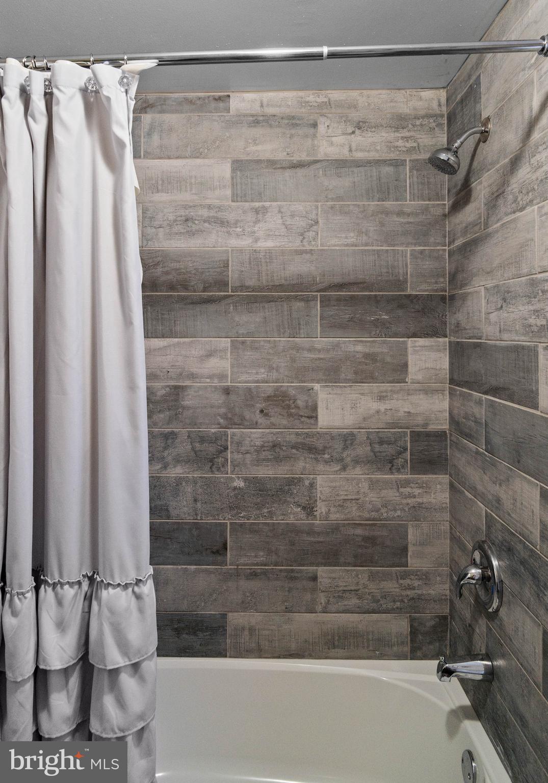 197 Ridge Street Smokerun, PA 16681 - Photo 33 of 47 a bathroom with a shower and a tub