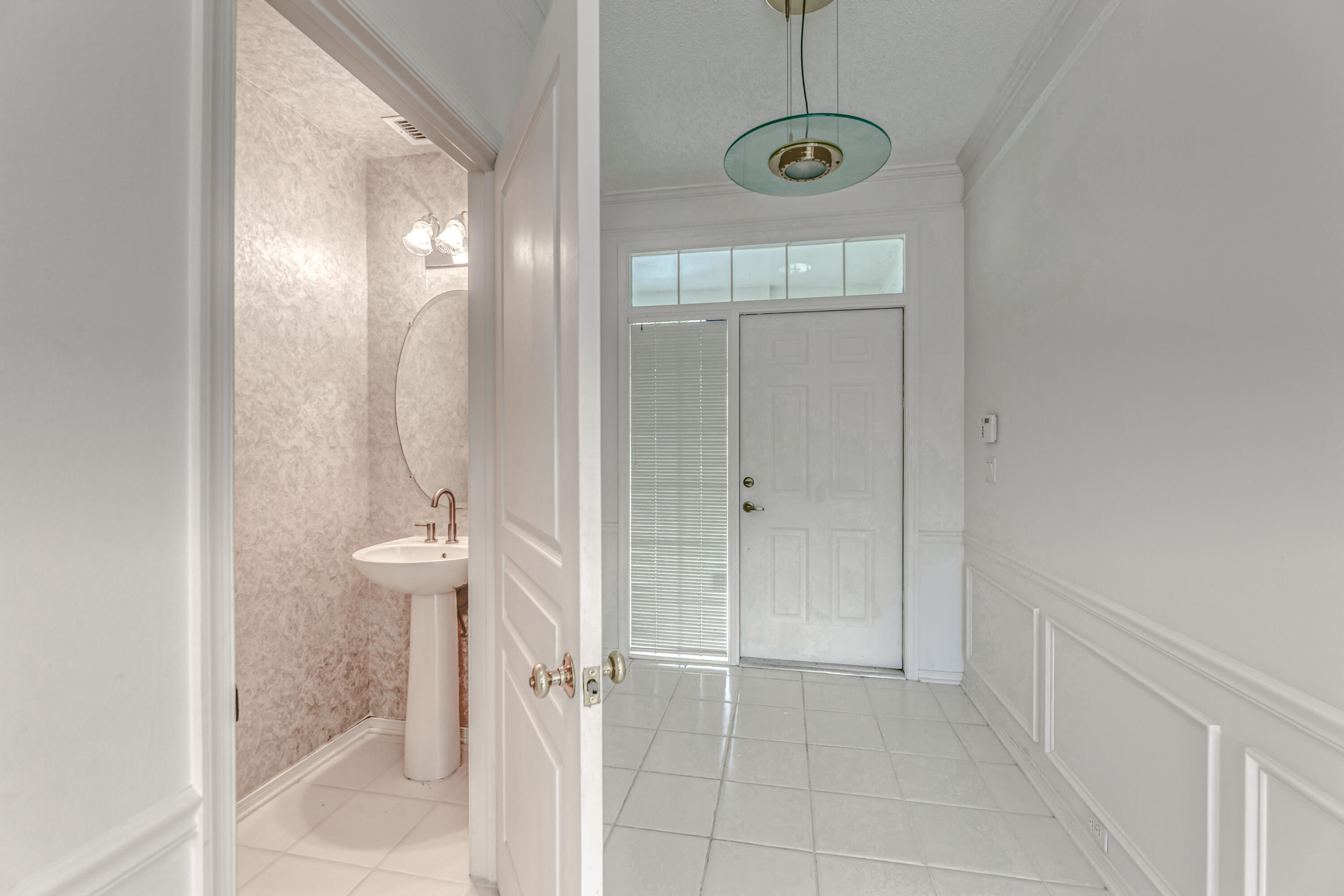5409 Grand Park Place Boca Raton, FL 33431 - Photo 19 of 53 Foyer/Guest Bathroom
