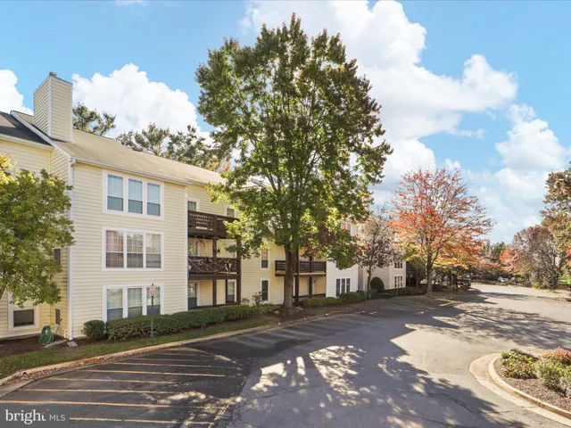 a view of a large building with large trees