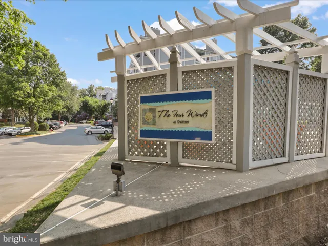 a front view of a building with a garden