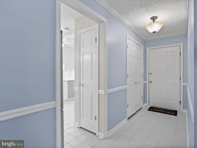 a kitchen with cabinets stainless steel appliances a sink and a stove