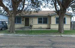 4809 South Bonham Street Amarillo, TX 79110 - Photo 1 of 1 a view of a house with a tree and a yard