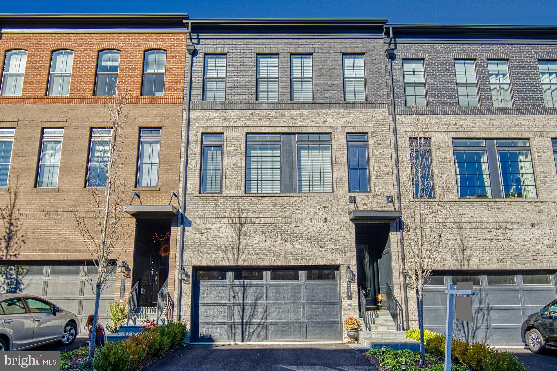 42288 Porter Ridge Terrace Brambleton, VA 20148 - Photo 1 of 30 Brick front with lots of windows