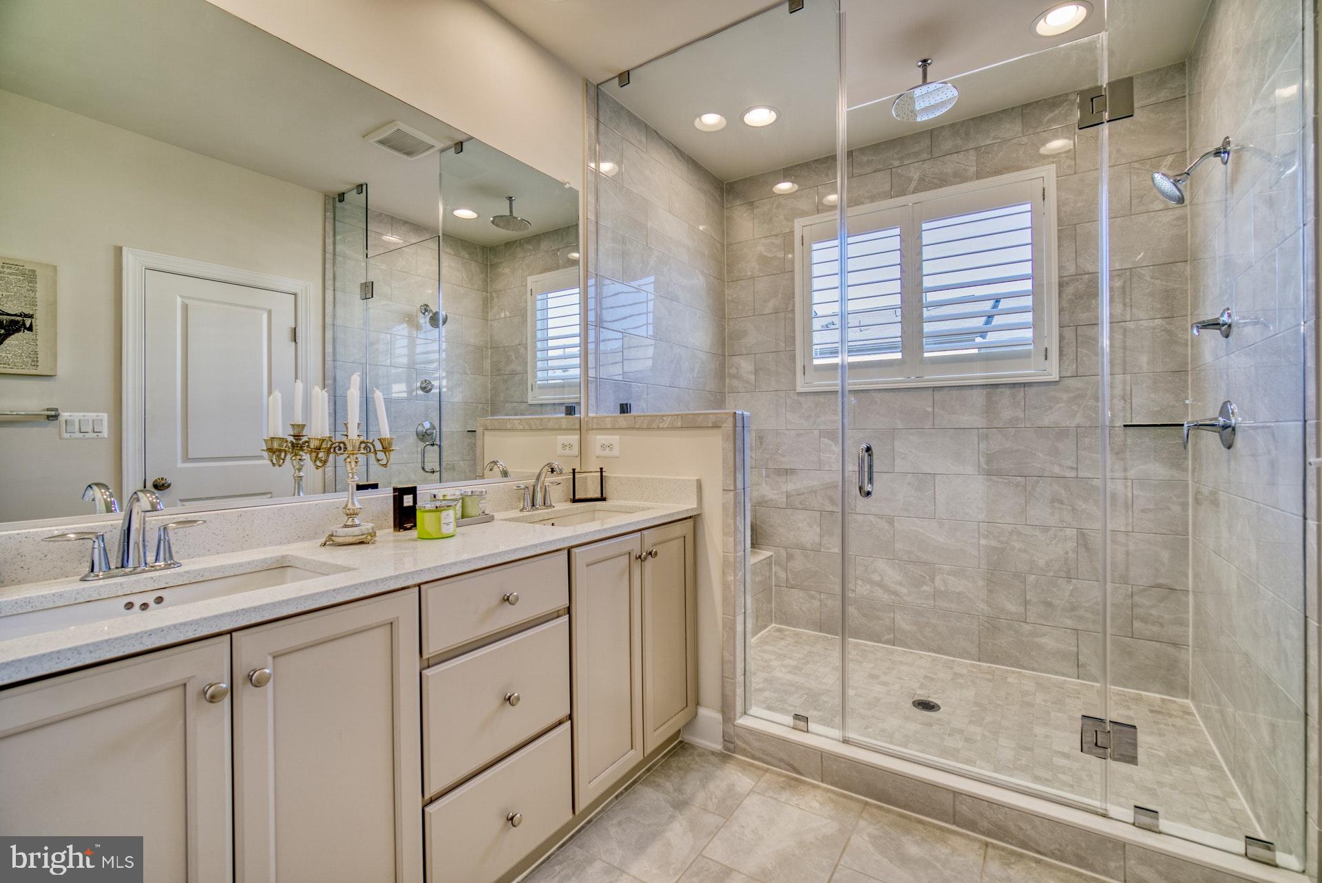 42288 Porter Ridge Terrace Brambleton, VA 20148 - Photo 16 of 30 Double sink and rimless shower
