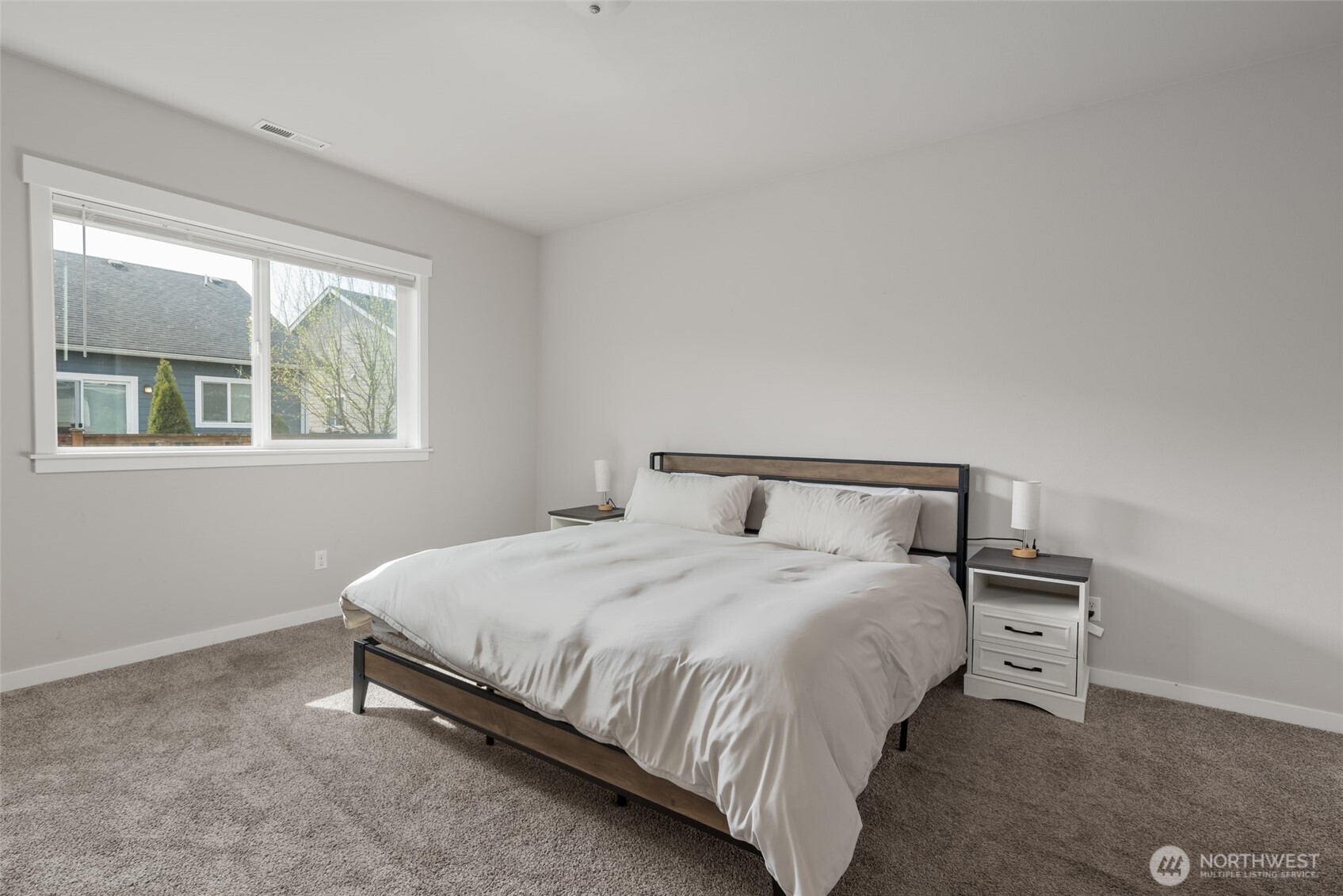 1768 East Rio Vista Avenue Burlington, WA 98233 - Photo 15 of 37 a bedroom with a bed and a window