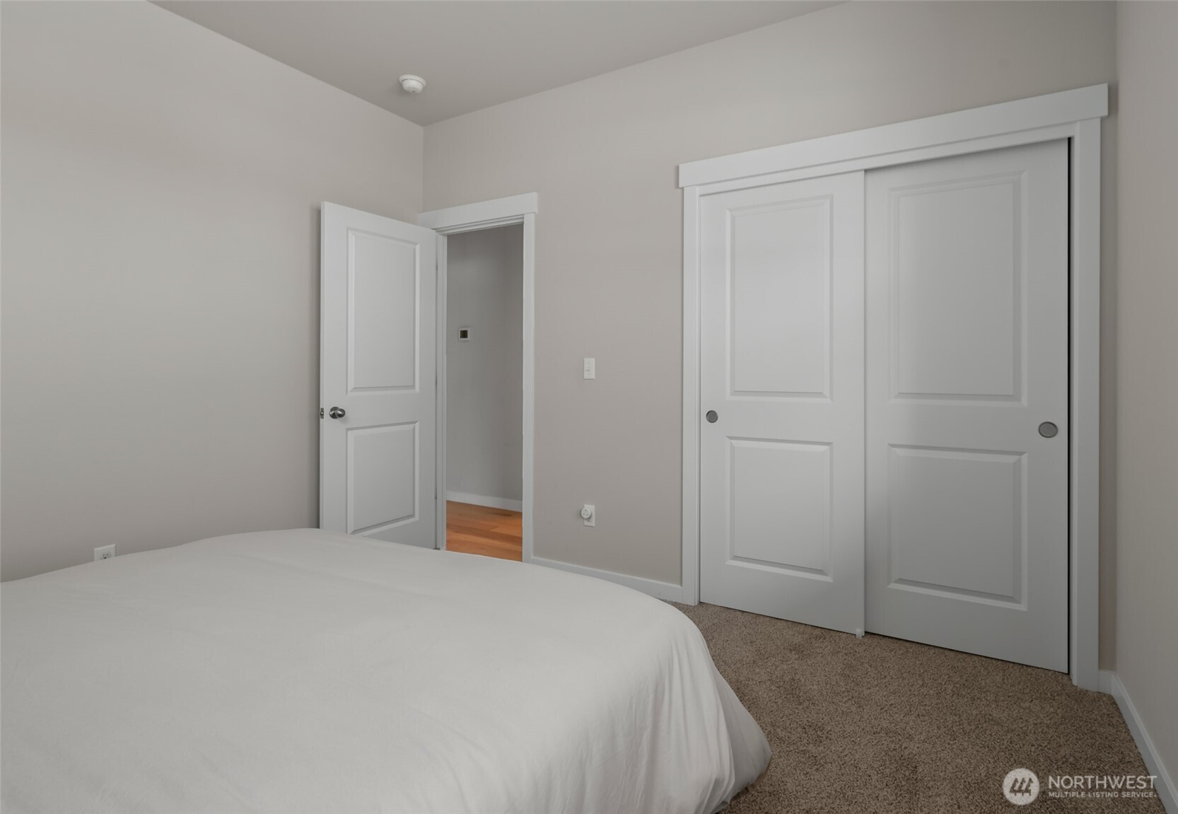 1768 East Rio Vista Avenue Burlington, WA 98233 - Photo 21 of 37 a bedroom with a bed and a lamp