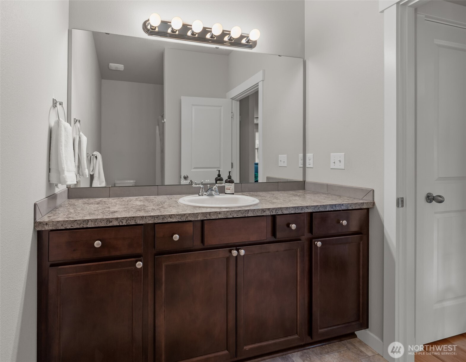 1768 East Rio Vista Avenue Burlington, WA 98233 - Photo 22 of 37 a bathroom with a granite countertop sink and a mirror