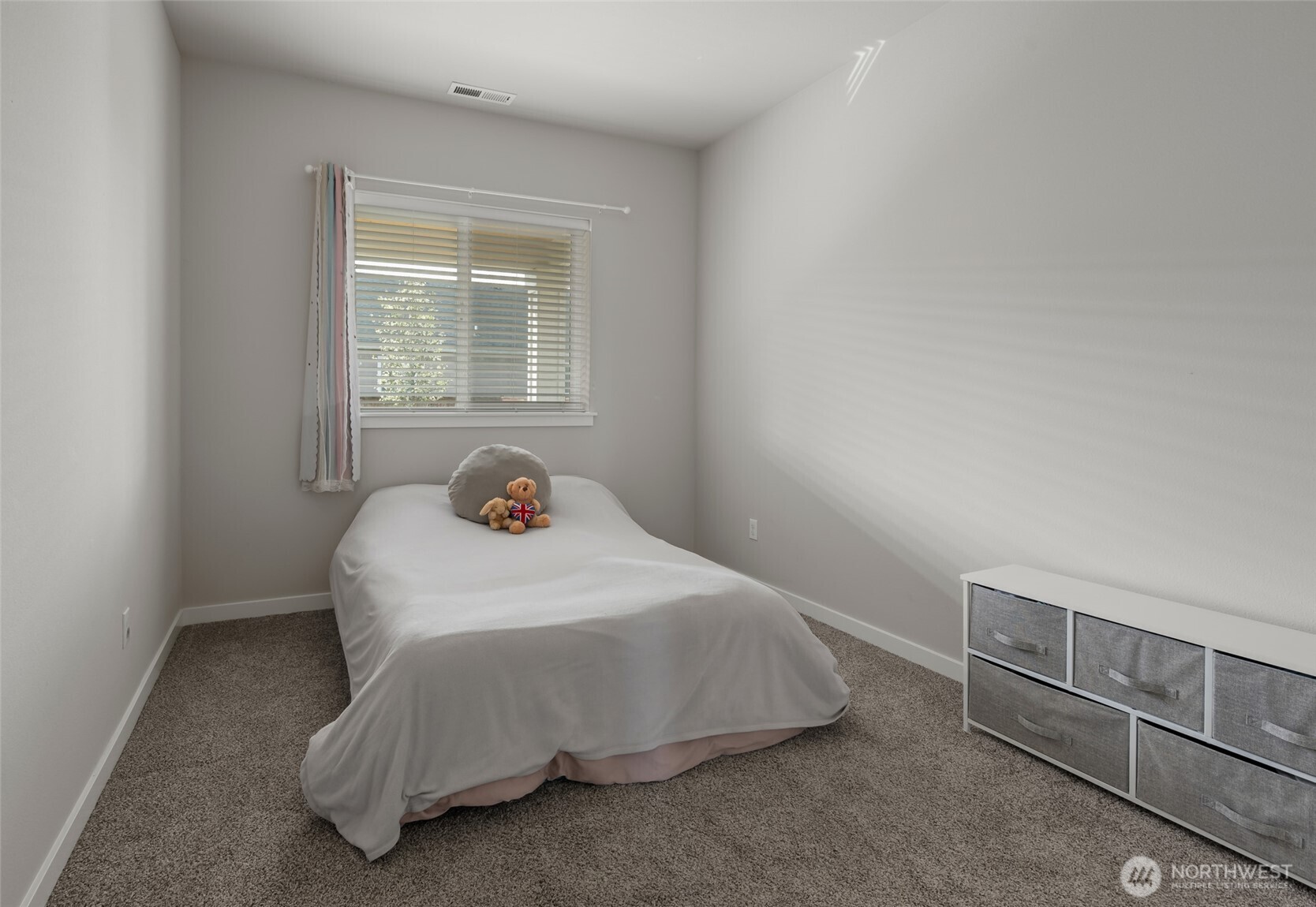 1768 East Rio Vista Avenue Burlington, WA 98233 - Photo 23 of 37 a bedroom with a bed and window