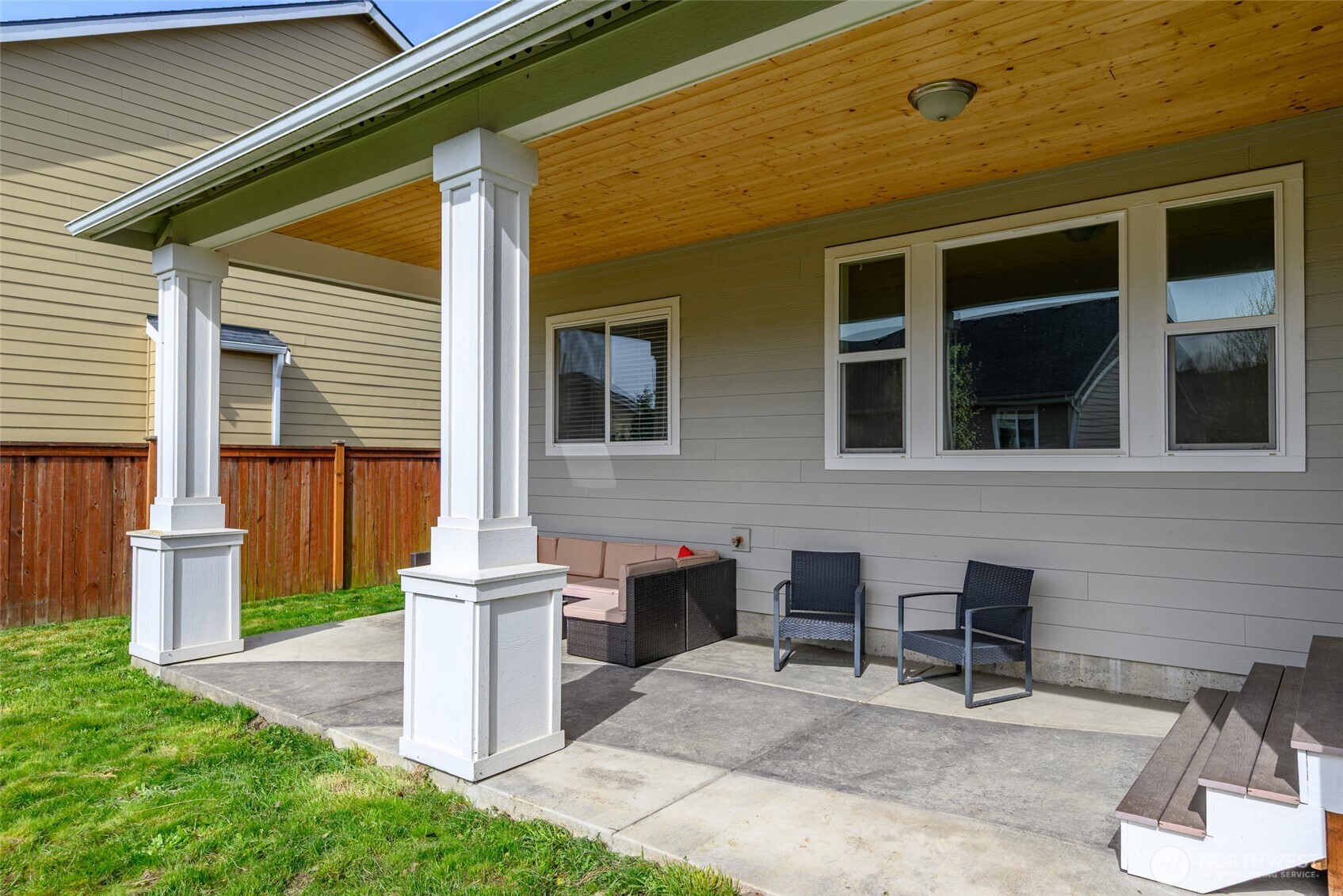 1768 East Rio Vista Avenue Burlington, WA 98233 - Photo 27 of 37 a front view of a house with a chairs and table in a patio