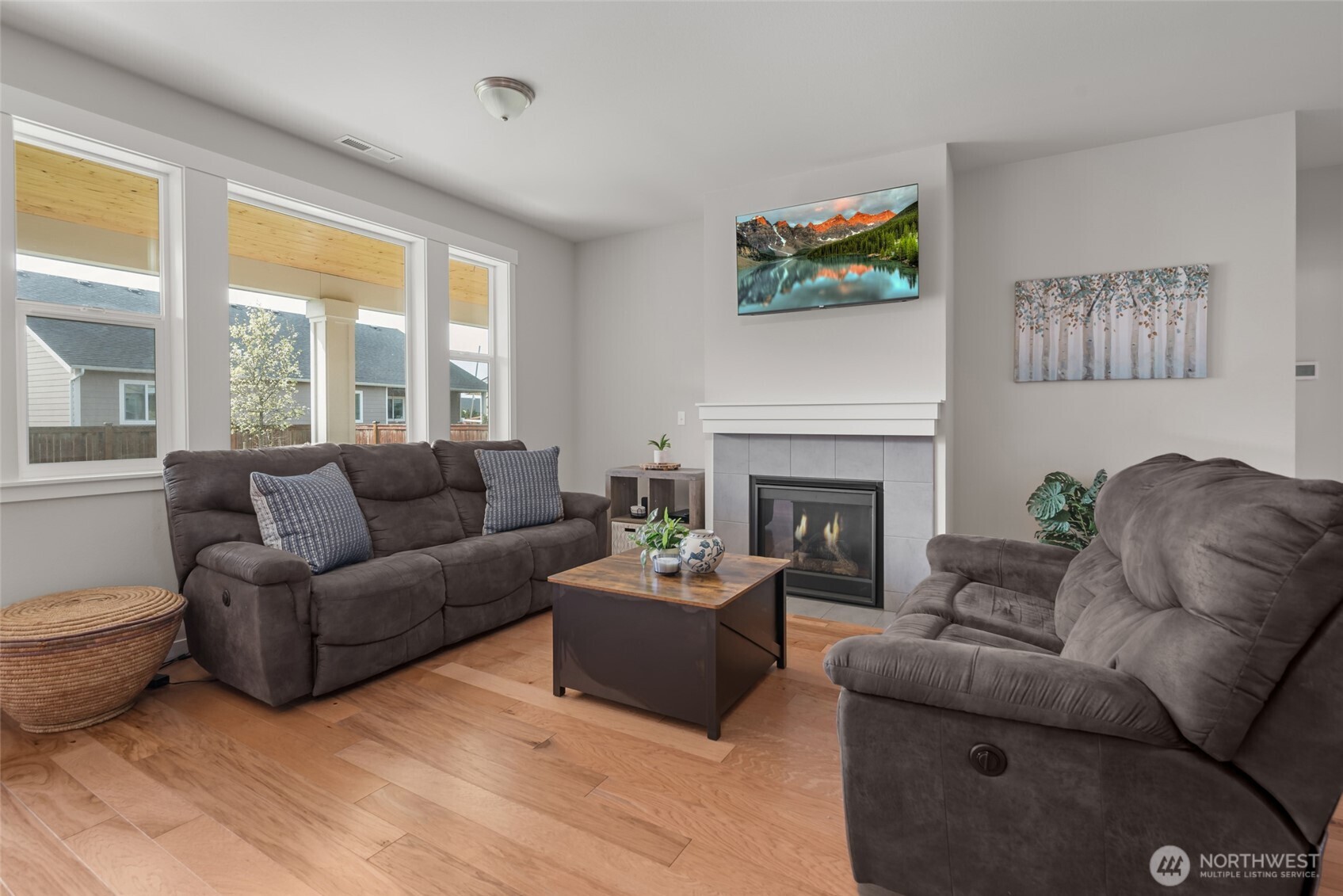1768 East Rio Vista Avenue Burlington, WA 98233 - Photo 3 of 37 a living room with furniture a fireplace and a large window
