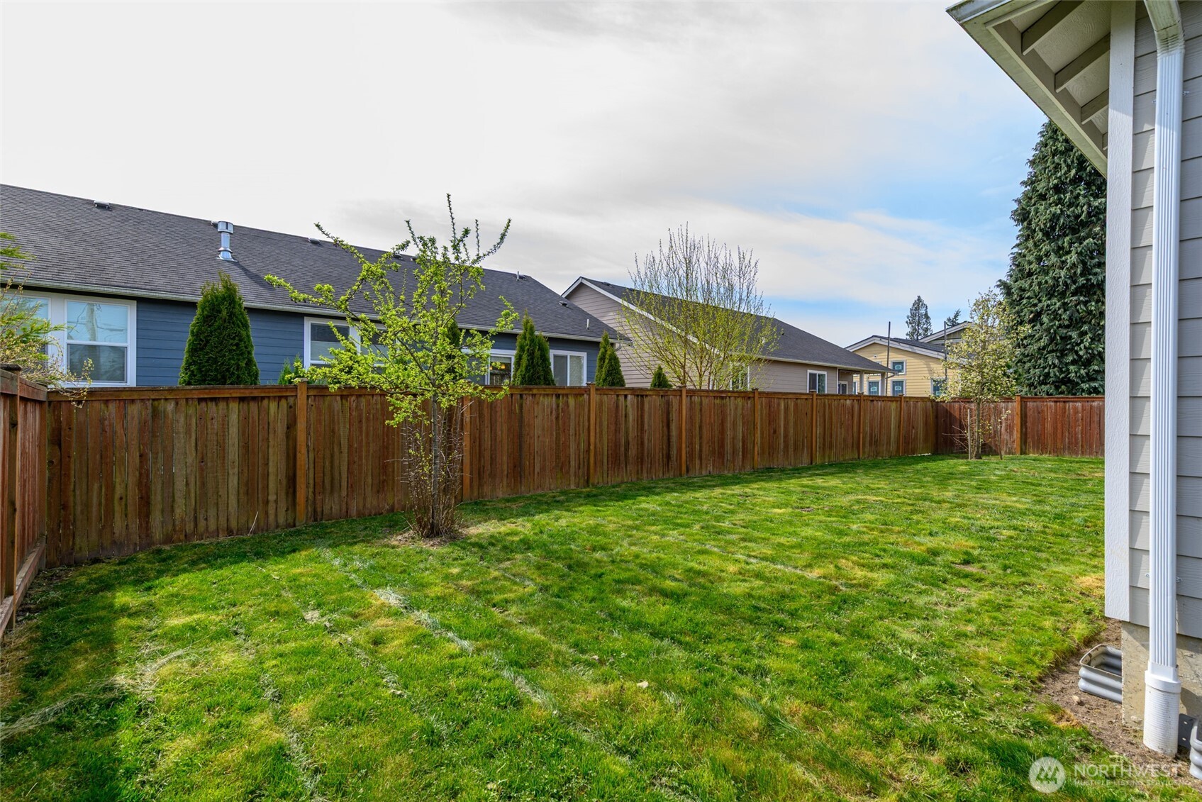 1768 East Rio Vista Avenue Burlington, WA 98233 - Photo 32 of 37 a view of a backyard with wooden fence
