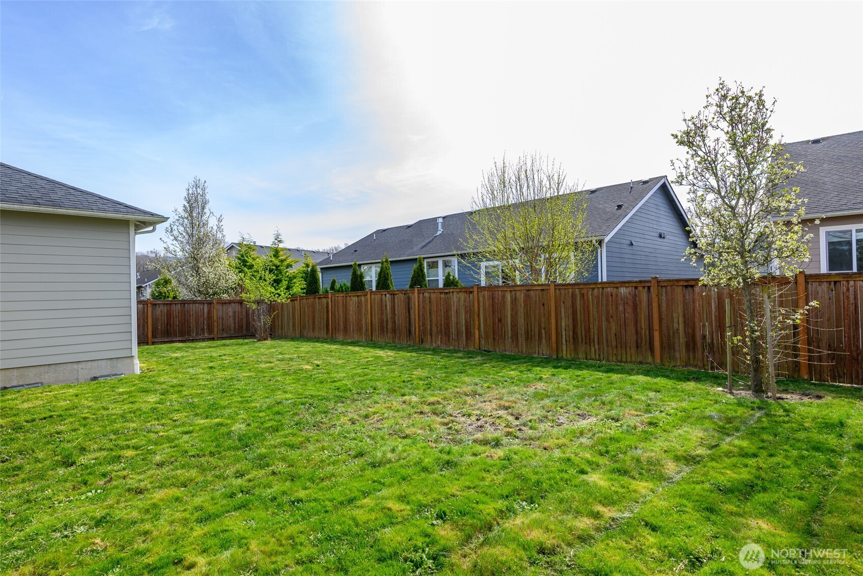 1768 East Rio Vista Avenue Burlington, WA 98233 - Photo 33 of 37 a view of a backyard with wooden fence