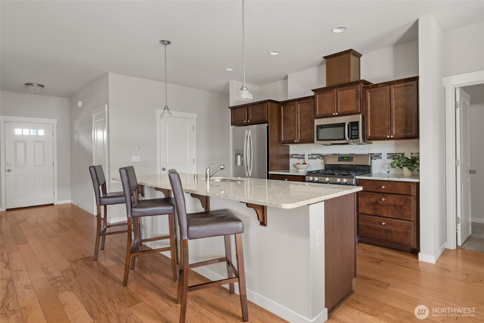 1768 East Rio Vista Avenue Burlington, WA 98233 - Photo 9 of 37 a kitchen with kitchen island granite countertop a sink and counter space