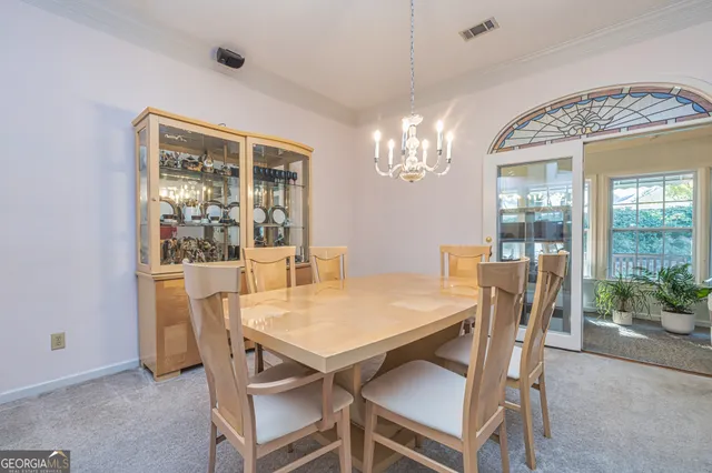 a view of a dining room with furniture window and outside view