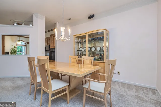 a dining room with furniture and window