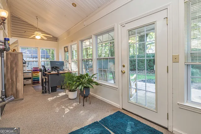 a room with furniture and a potted plant
