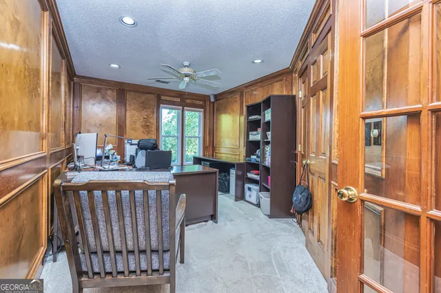 a view of a hallway with furniture and window