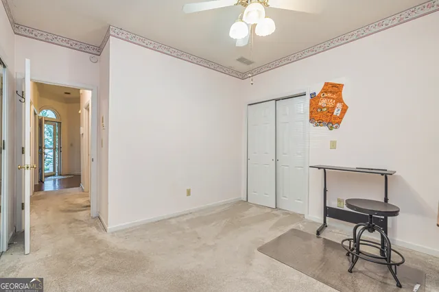 a view of a hallway with a livingroom
