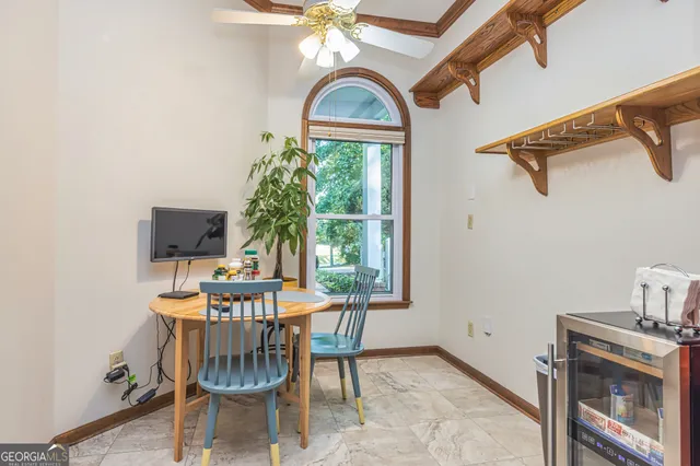 a view of a dining room with furniture window and outside view