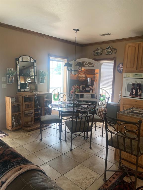 1980 Compass Way Bluff Dale, TX 76433 - Photo 9 of 16 a room with lots of wooden furniture and windows