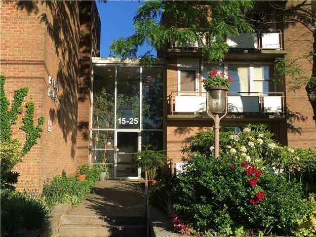 25 Ellsworth Street, Unit 14 Bridgeport, CT 06605 - Photo 1 of 1 a front view of a house with a yard