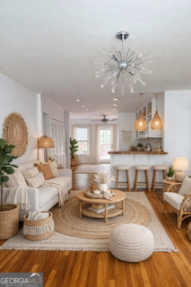 1875 Brewer Boulevard Southwest Atlanta, GA 30310 - Photo 13 of 15 a living room with furniture and a chandelier