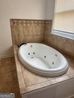 1875 Brewer Boulevard Southwest Atlanta, GA 30310 - Photo 4 of 15 a white bath tub sitting in a bathroom