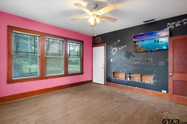 a view of an empty room with a window