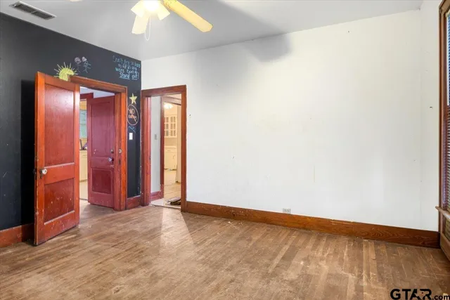 an empty room with closet area