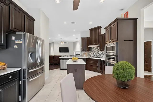 a view of backyard with a patio