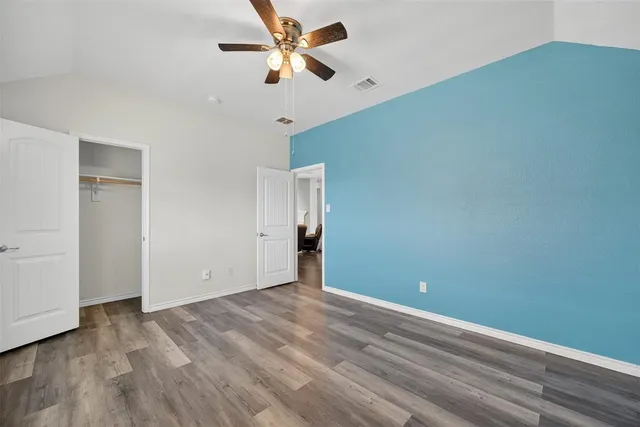 a view of an empty room and a window