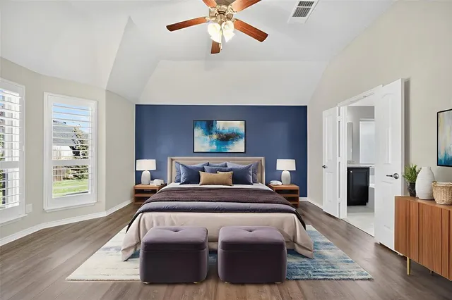 an empty room with closet and a chandelier fan