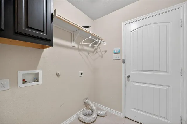 a bath room with a sink vanity tub and a mirror