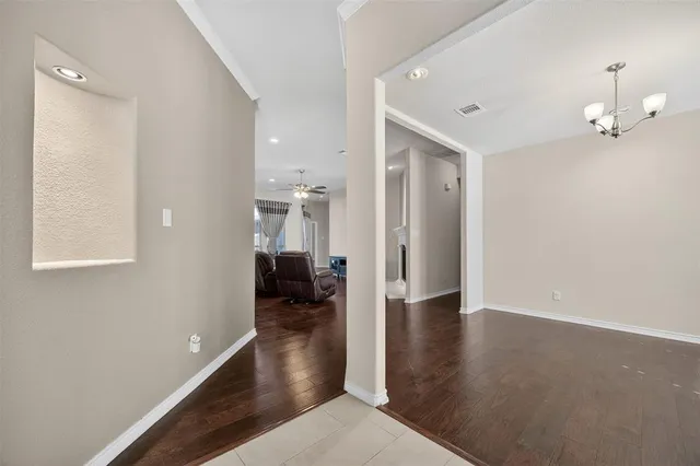 wooden floor in a hall with an entryway