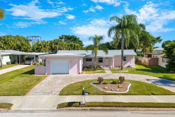 a view of a house with swimming pool and a yard