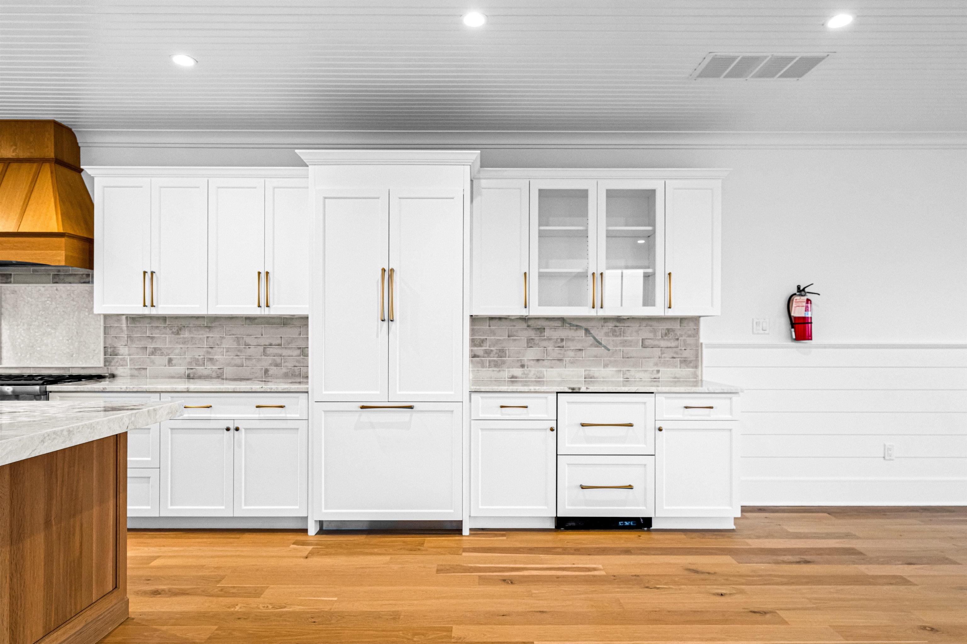 2148 Ocean, Unit 2148 Avalon, NJ 08202 - Photo 21 of 40 a kitchen with granite countertop white cabinets and white appliances