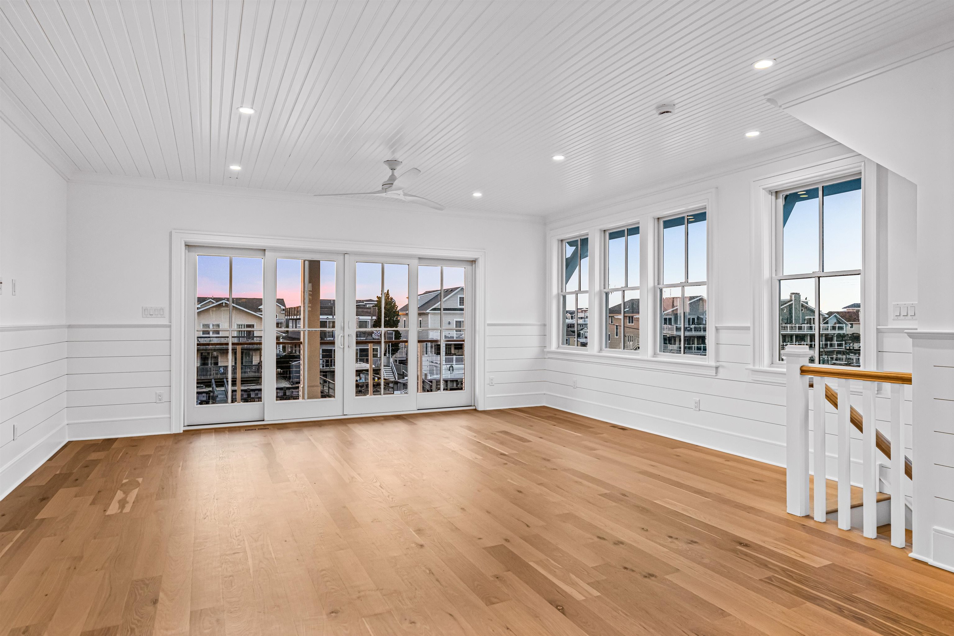 2148 Ocean, Unit 2148 Avalon, NJ 08202 - Photo 23 of 40 a view of an empty room with wooden floor and a window