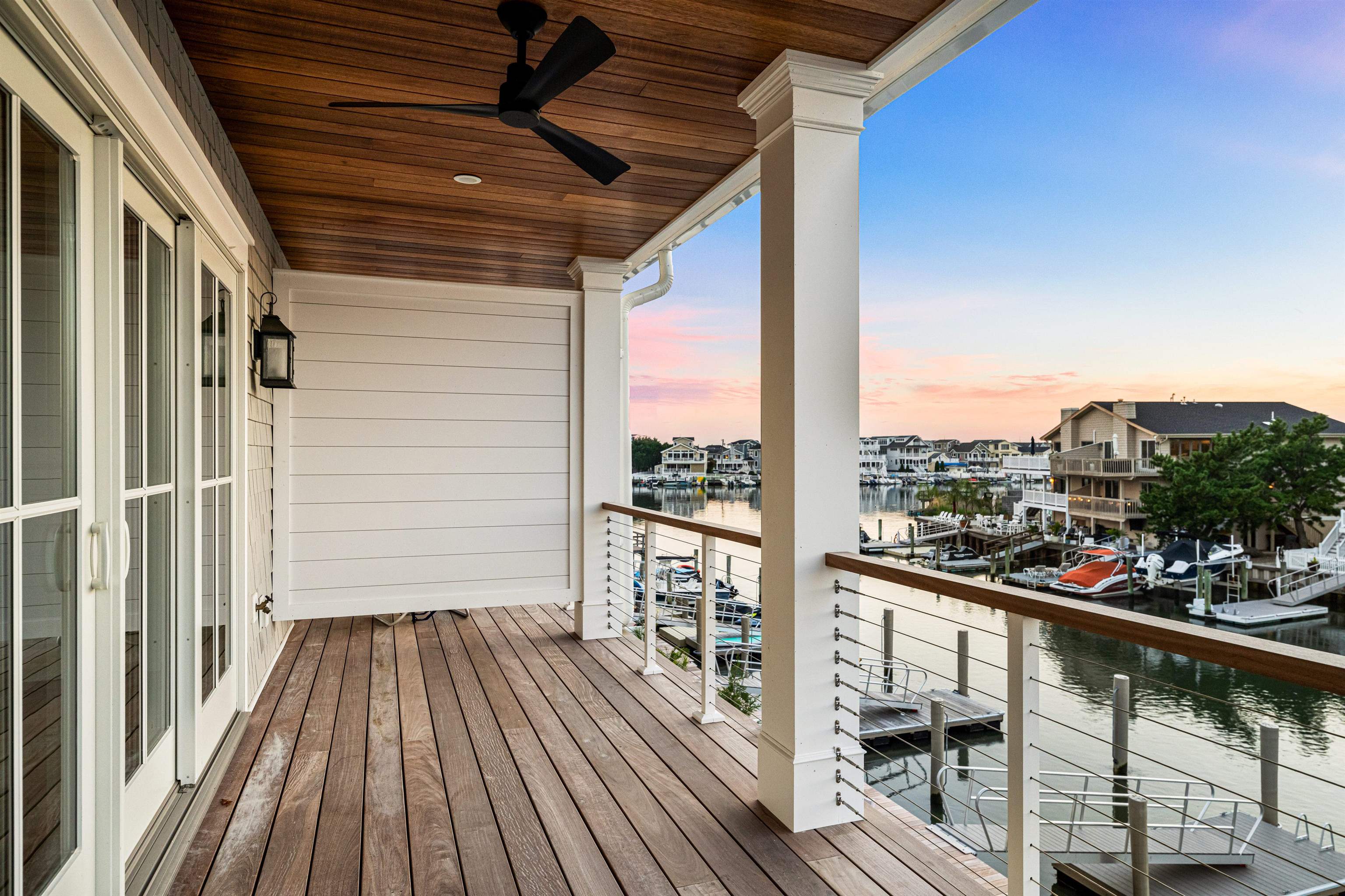 2148 Ocean, Unit 2148 Avalon, NJ 08202 - Photo 26 of 40 a view of a balcony with wooden floor