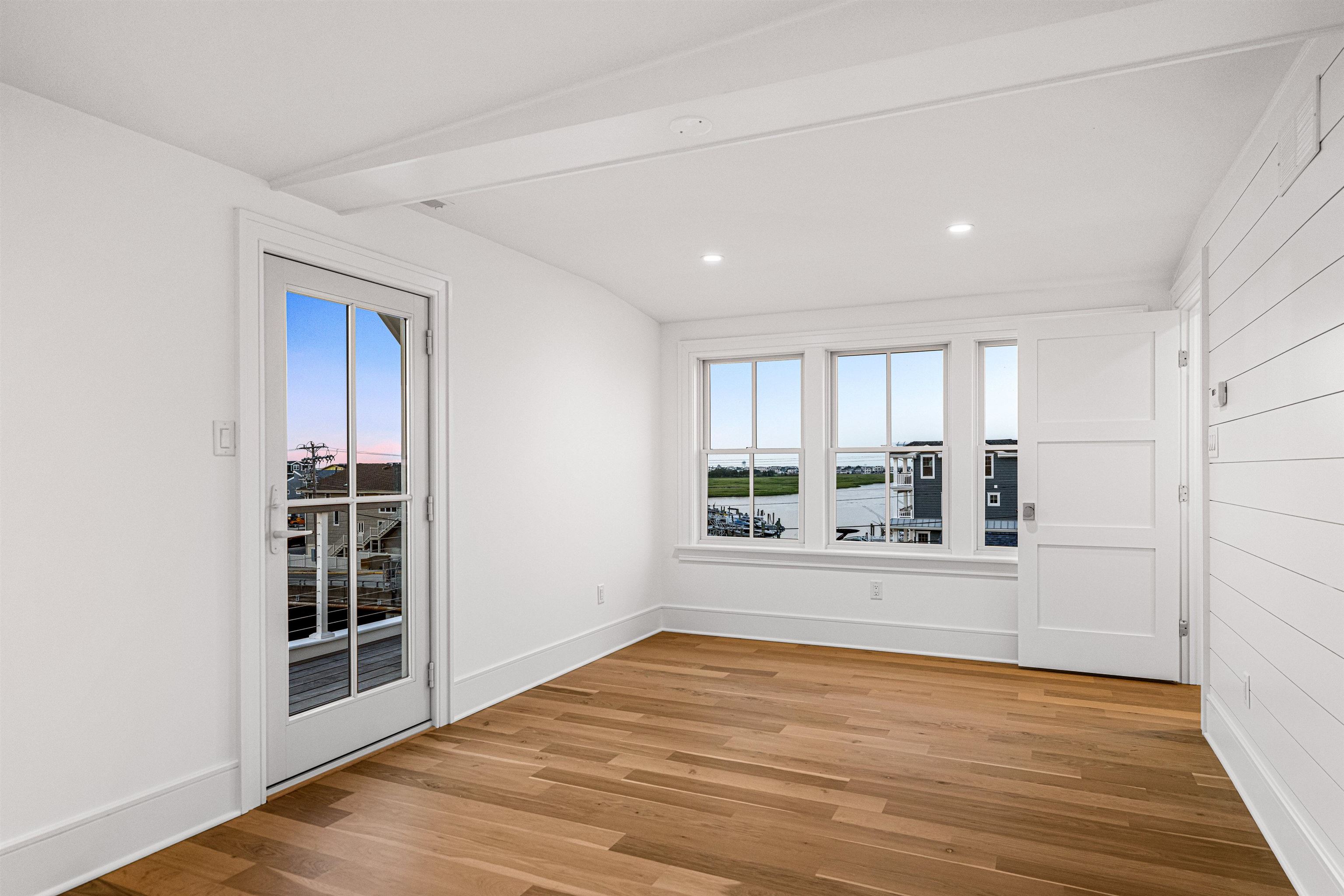 2148 Ocean, Unit 2148 Avalon, NJ 08202 - Photo 30 of 40 a view of a kitchen with wooden floor and a window
