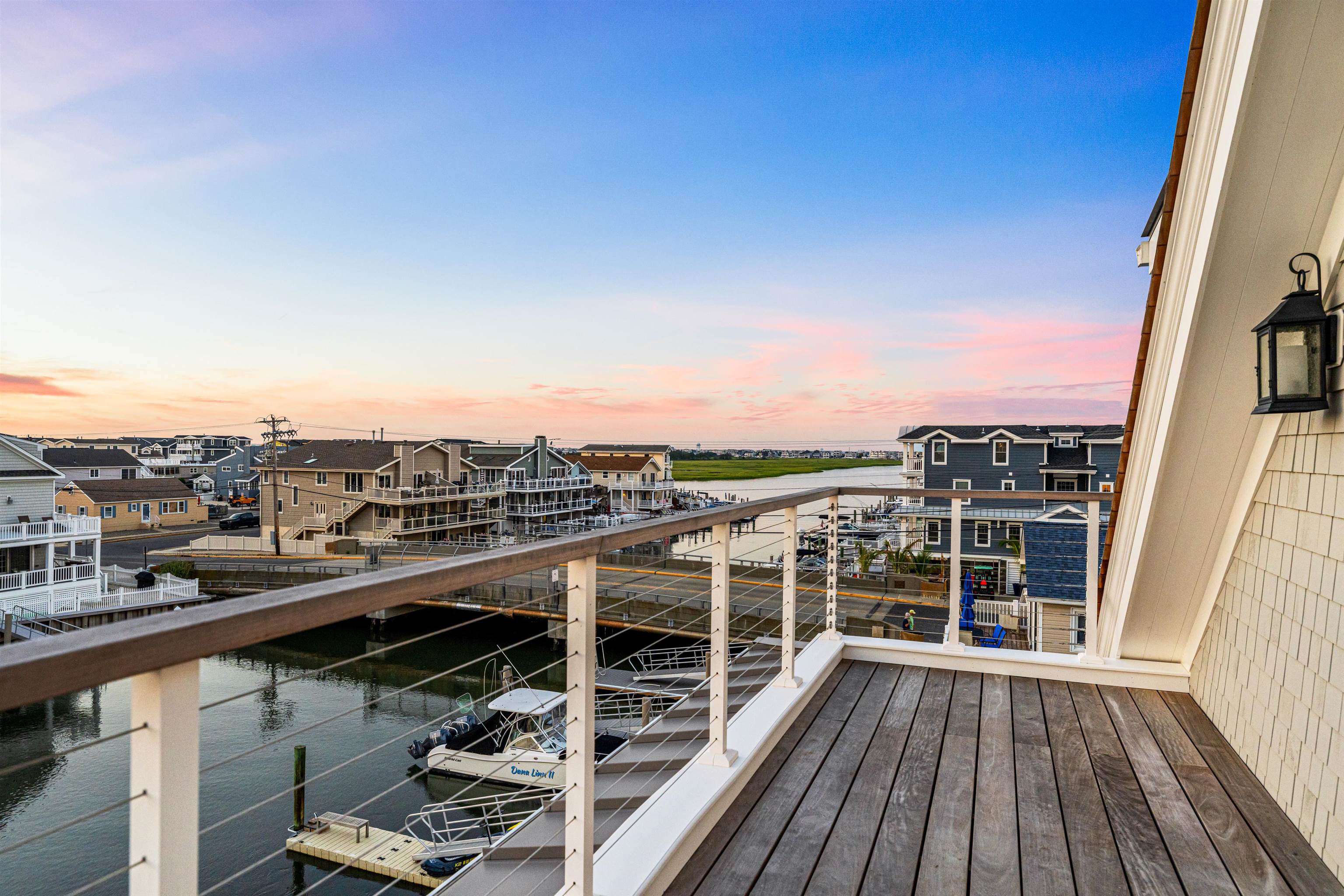 2148 Ocean, Unit 2148 Avalon, NJ 08202 - Photo 34 of 40 a view of a balcony with wooden floor and city view