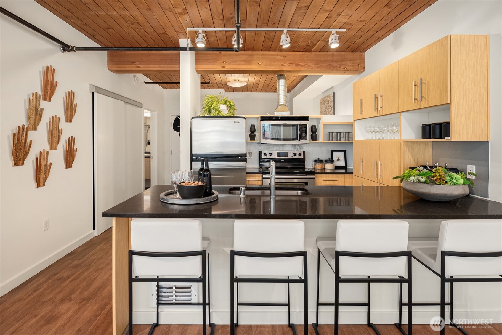 401 9th Avenue North, Unit 210 Seattle, WA 98109 - Photo 12 of 30 a kitchen with stainless steel appliances granite countertop a sink and a refrigerator