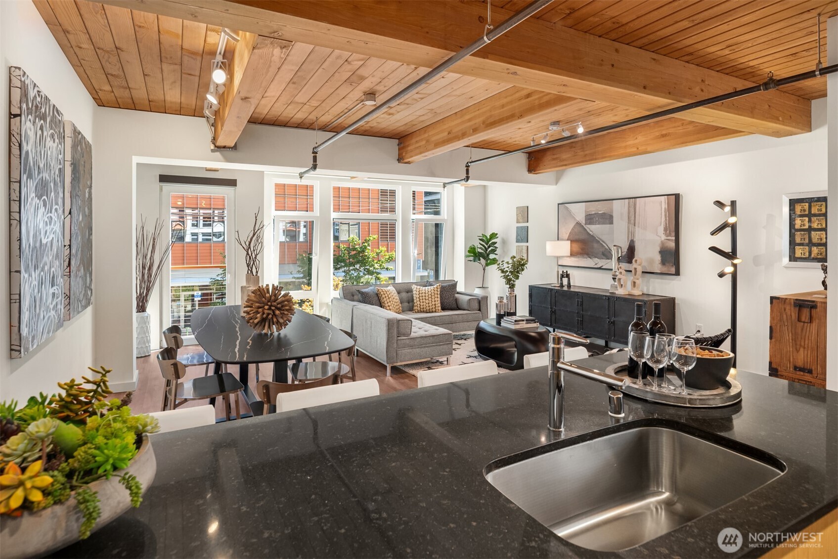 401 9th Avenue North, Unit 210 Seattle, WA 98109 - Photo 13 of 30 a living room with furniture and a potted plant