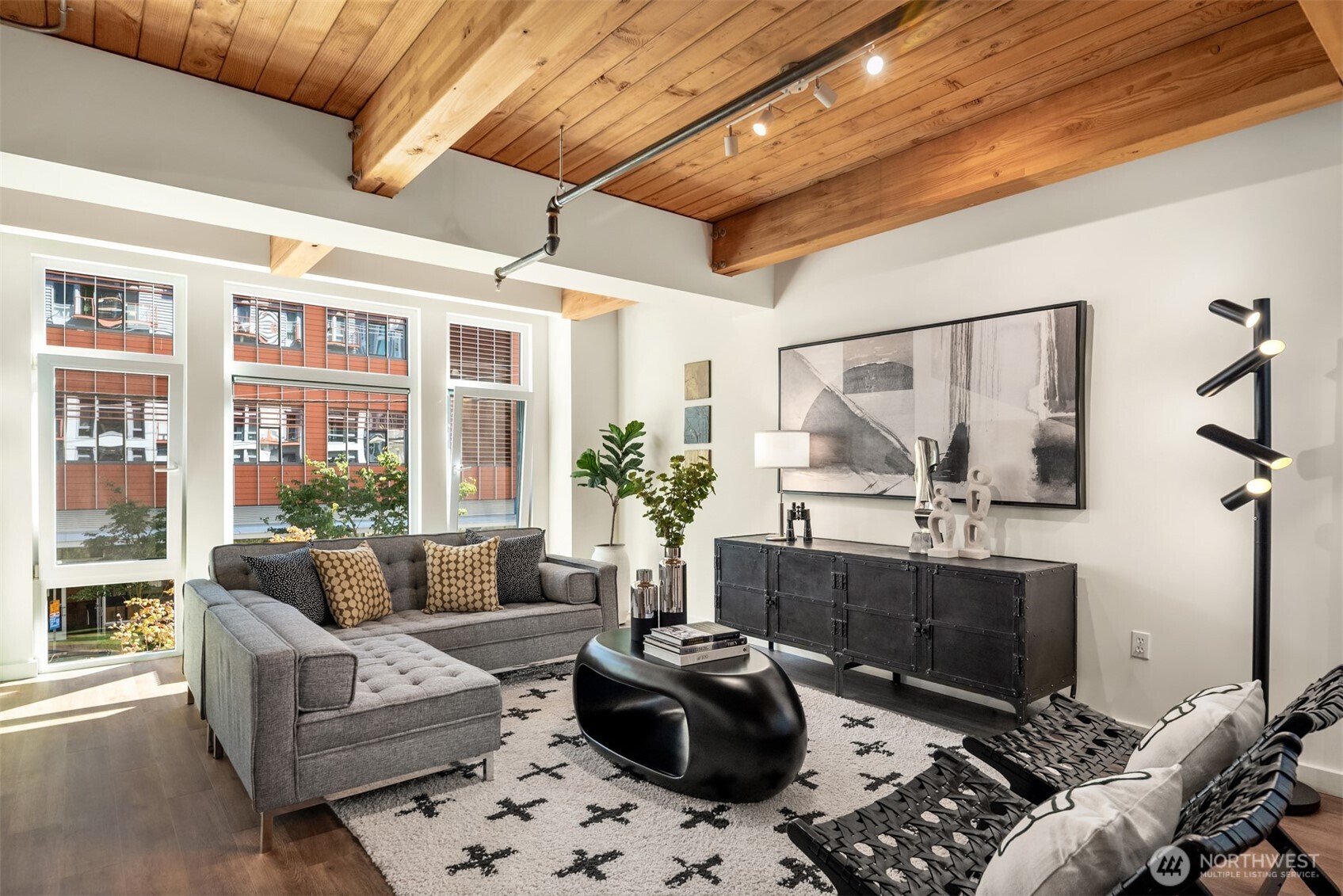 401 9th Avenue North, Unit 210 Seattle, WA 98109 - Photo 14 of 30 a living room with furniture and a large window