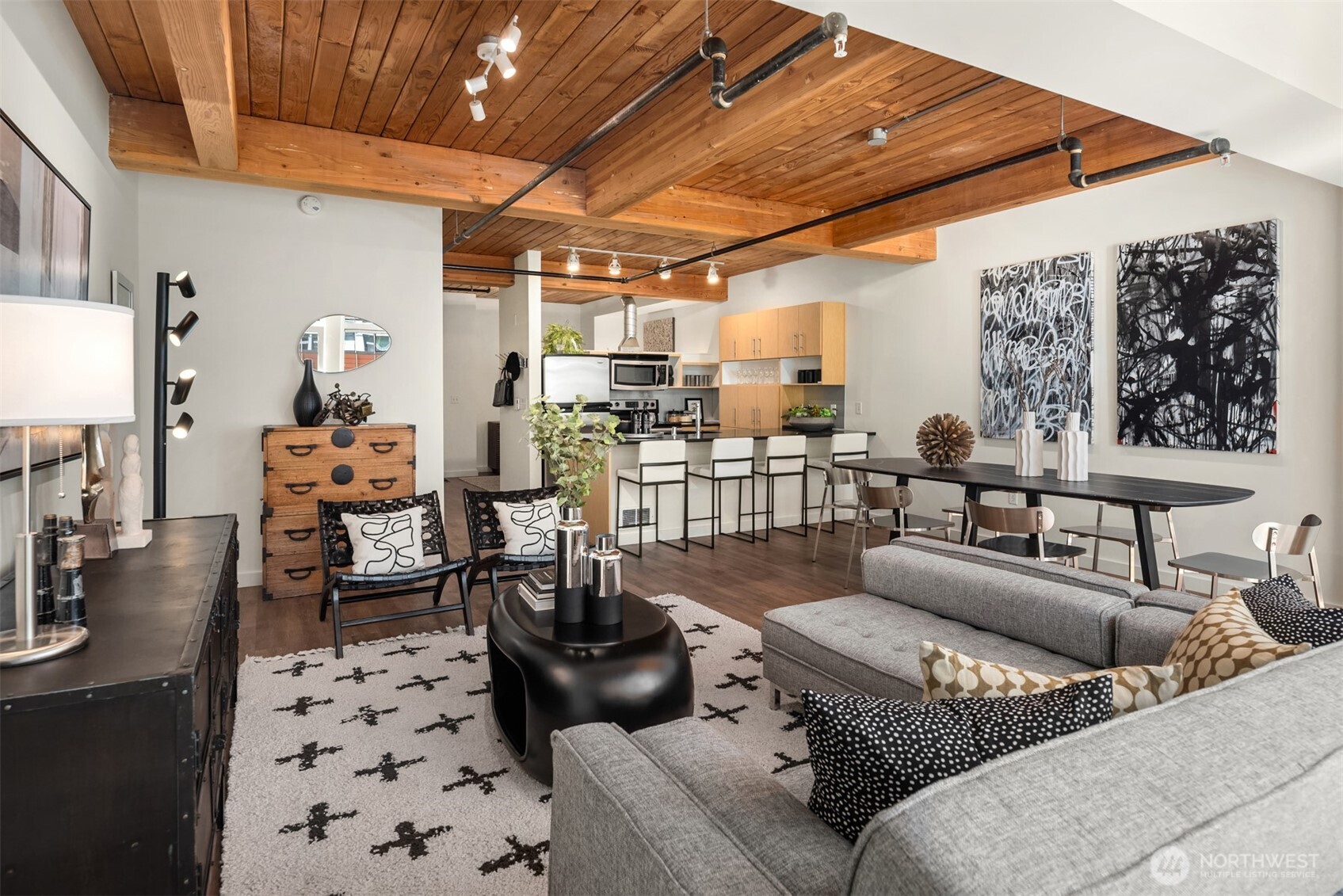 401 9th Avenue North, Unit 210 Seattle, WA 98109 - Photo 19 of 30 a living room with furniture and a chandelier