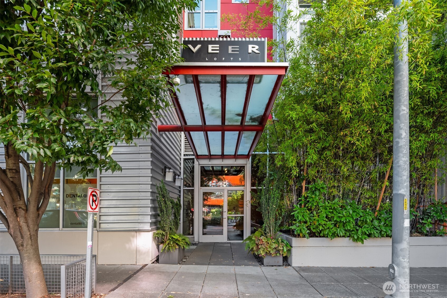 401 9th Avenue North, Unit 210 Seattle, WA 98109 - Photo 2 of 30 a front view of a house with garden