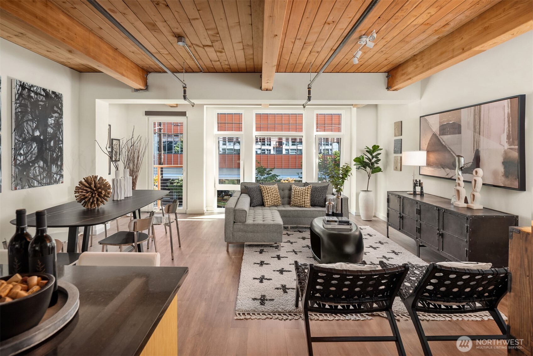 401 9th Avenue North, Unit 210 Seattle, WA 98109 - Photo 21 of 30 a living room with furniture a rug a fireplace and a large window